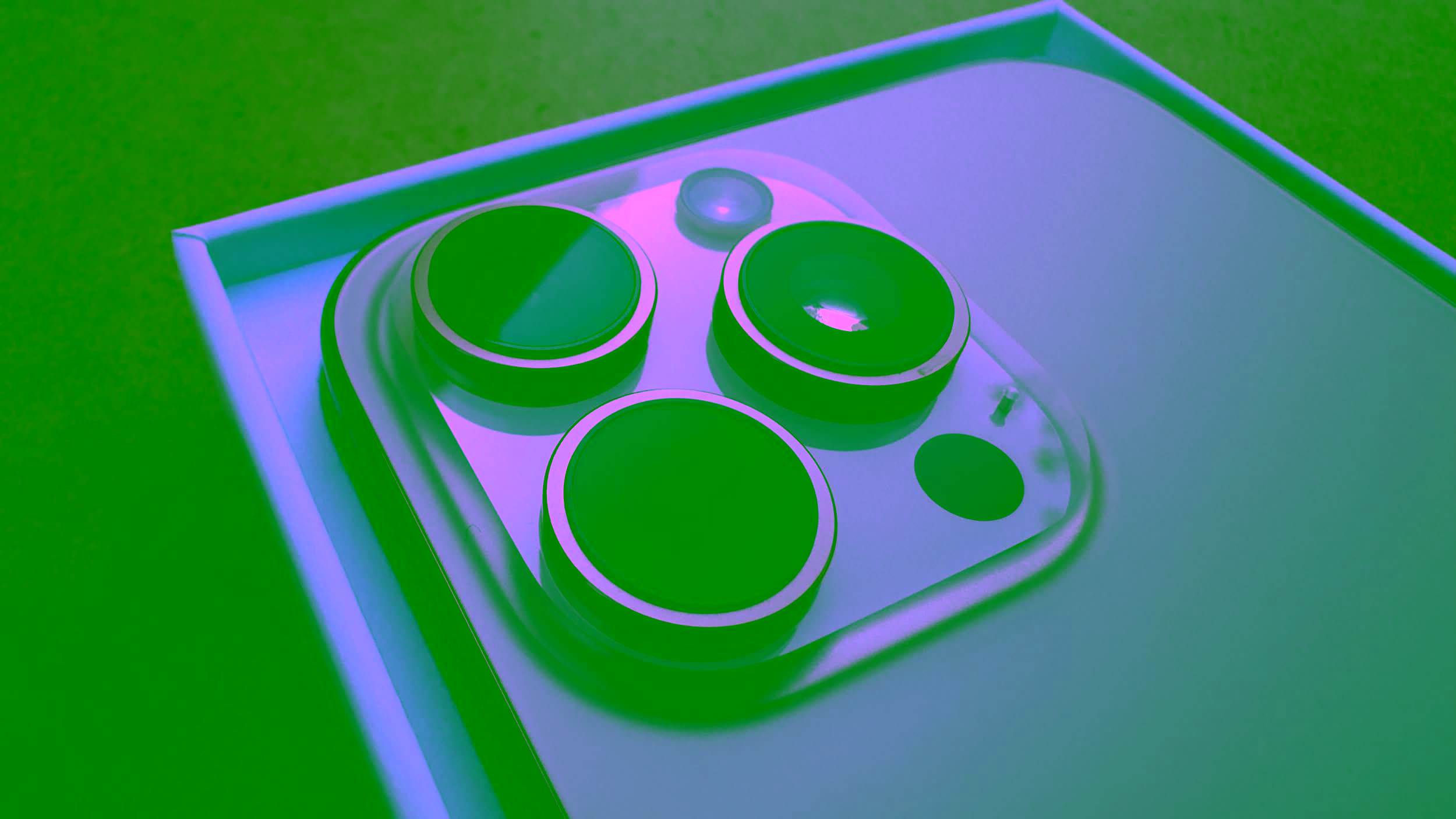 A close-up shot of the iPhone 16's rear camera module, showing three lenses and the flash, all placed within the phone’s frosted matte finish.