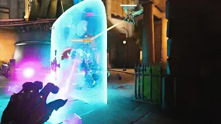 In-game screenshot showing a character using an energy shield in Overwatch.