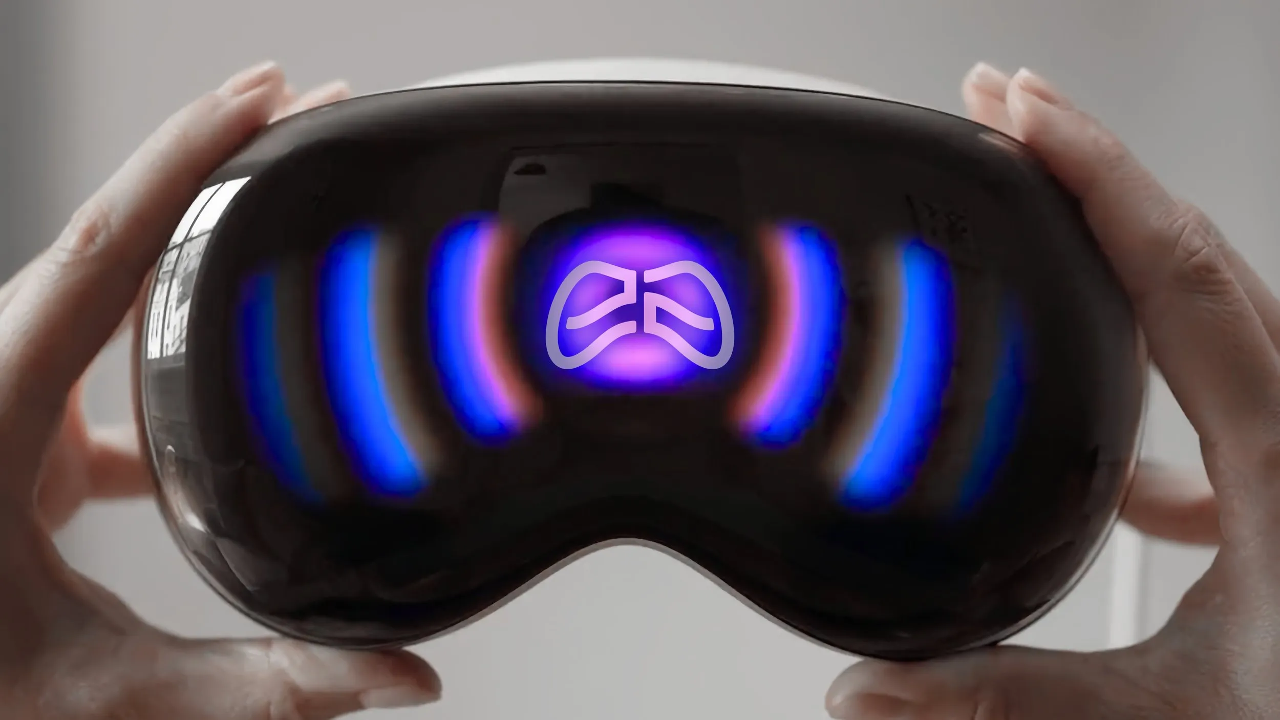 A close-up of a person holding an electronic eye mask. The mask is sleek and black with glowing blue and purple light patterns on the surface. Hands of the person are visible on the sides adjusting the mask.