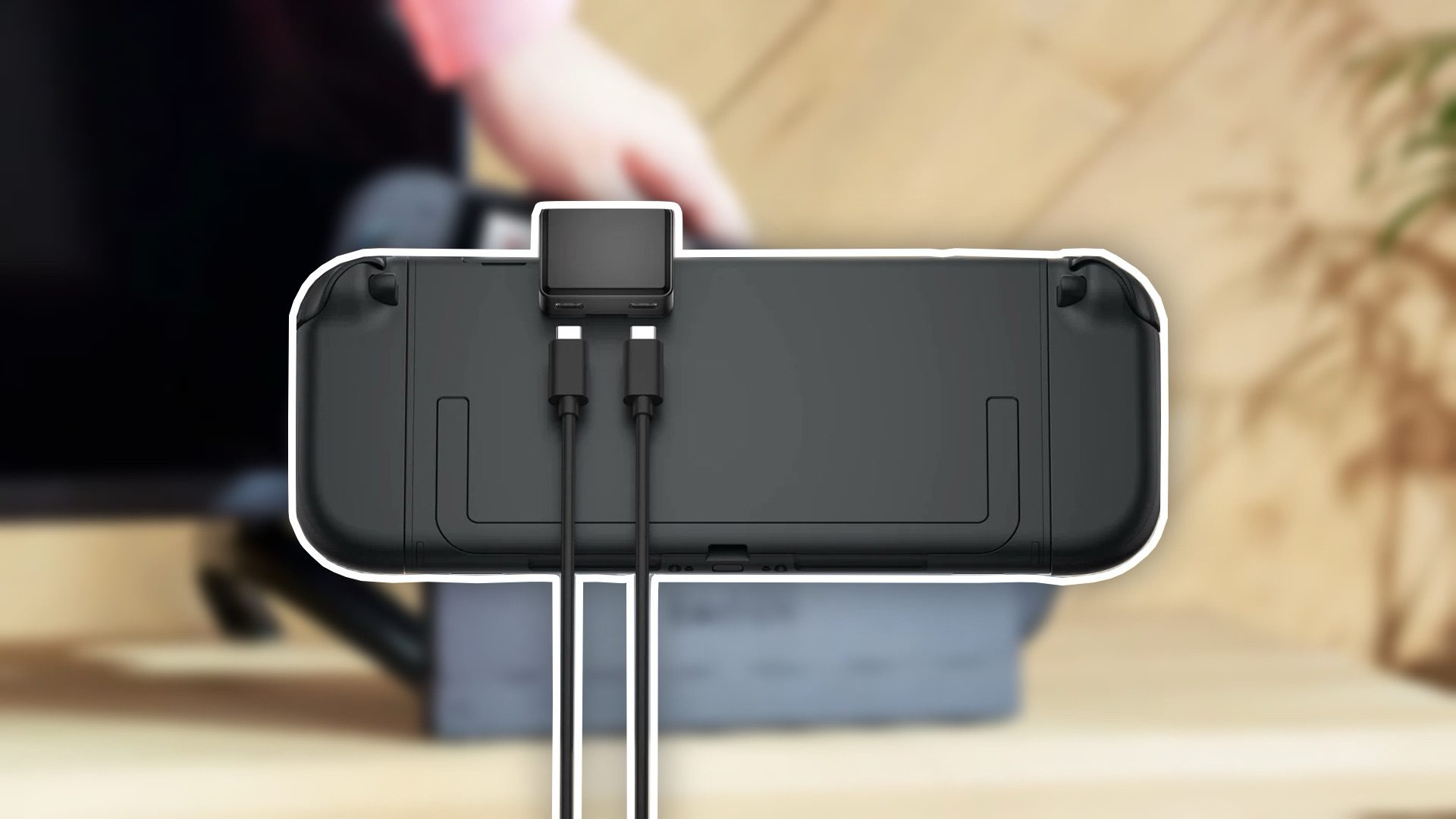 Back view of a gaming controller with a charging cable connected to it.